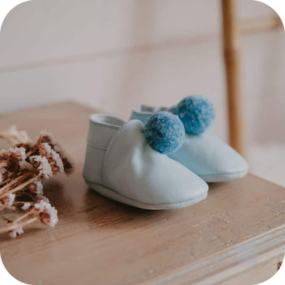 Baby booties with pompoms Sky blue