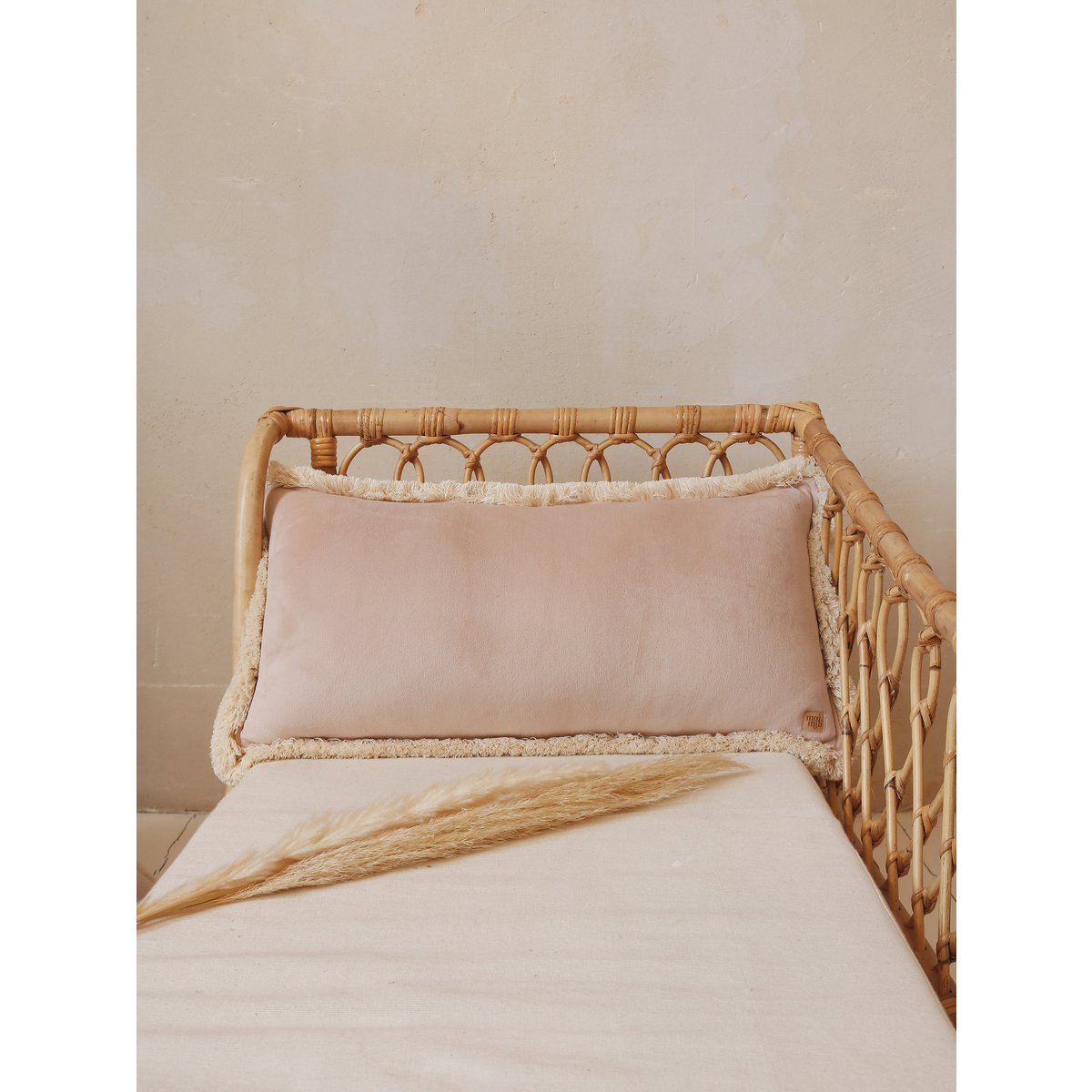 Soft velvet bolster "Latte" with fringe