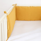 Bed bumper made of honey-colored organic cotton