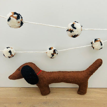 Slinger pompom luipaard off-wit 2m wol