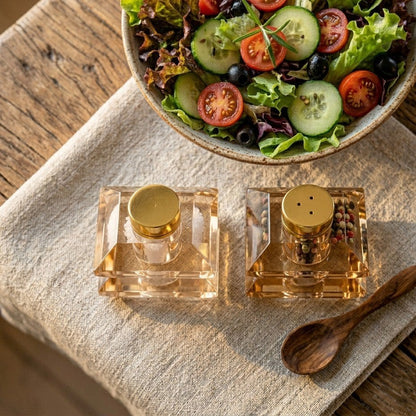 Designer salt and pepper shakers in amber glass