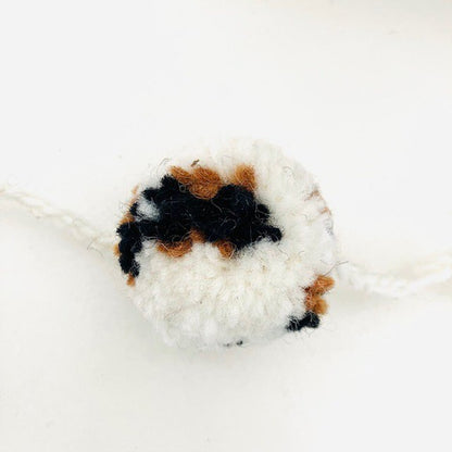 Slinger pompom luipaard off-wit 2m wol