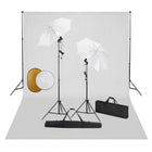 Photo studio set with lights, umbrellas, backdrop, and reflector