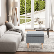 Stool with wooden legs, light grey fabric
