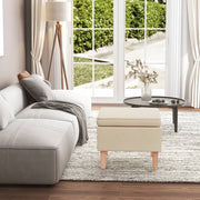 Stool with wooden legs, cream-colored fabric