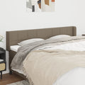 Hoofdbord met randen 163x16x78/88 cm stof taupe