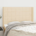 Hoofdbord met randen 147x16x118/128 cm stof crèmekleurig