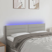 Hoofdbord 144x5x78/88 cm stof lichtgrijs LED
