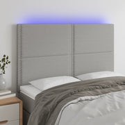 Hoofdbord 144x5x118/128 cm stof lichtgrijs LED