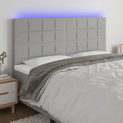Hoofdbord 160x5x118/128 cm stof lichtgrijs LED