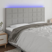 Hoofdbord 180x5x118/128 cm stof lichtgrijs met LED