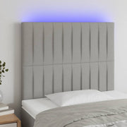Hoofdbord 90x5x118/128 cm stof lichtgrijs LED