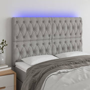 Hoofdbord 144x7x118/128 cm stof lichtgrijs LED