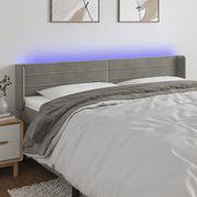 Hoofdbord 203x16x78/88 cm fluweel lichtgrijs LED