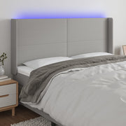 Hoofdbord 163x16x118/128 cm stof lichtgrijs LED