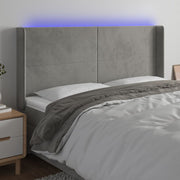 Hoofdbord 203x16x118/128 cm fluweel lichtgrijs LED