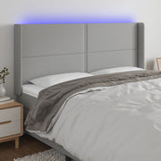 Hoofdbord 183x16x118/128 cm stof lichtgrijs LED