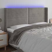 Hoofdbord 203x16x118/128 cm fluweel lichtgrijs LED