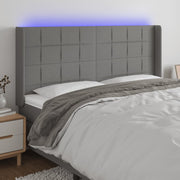 Hoofdbord 163x16x118/128 cm stof donkergrijs met LED