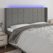Hoofdbord 183x16x118/128 cm stof donkergrijs LED