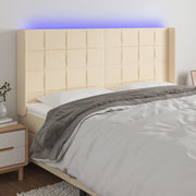 Hoofdbord 183x16x118/128 cm stof crèmekleurig LED