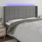 Hoofdbord 203x16x118/128 cm stof donkergrijs LED