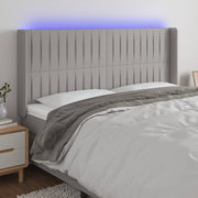 Hoofdbord 203x16x118/128 cm stof lichtgrijs LED