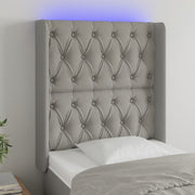 Hoofdbord 83x16x118/128 cm stof lichtgrijs LED