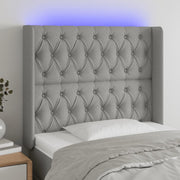 Hoofdbord 93x16x118/128 cm stof lichtgrijs LED