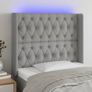 Hoofdbord 103x16x118/128 cm stof lichtgrijs LED