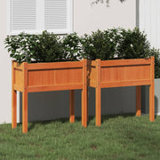 Plantenbakken met poten 2 st massief grenenhout wasbruin 70x31x70 cm