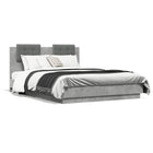 Bed frame with ornate wooden headboard concrete grey 120x190 cm
