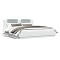 Bed frame with headboard and LED lighting white 180x200 cm
