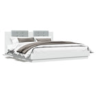 Bed frame with headboard and LED lighting white 180x200 cm
