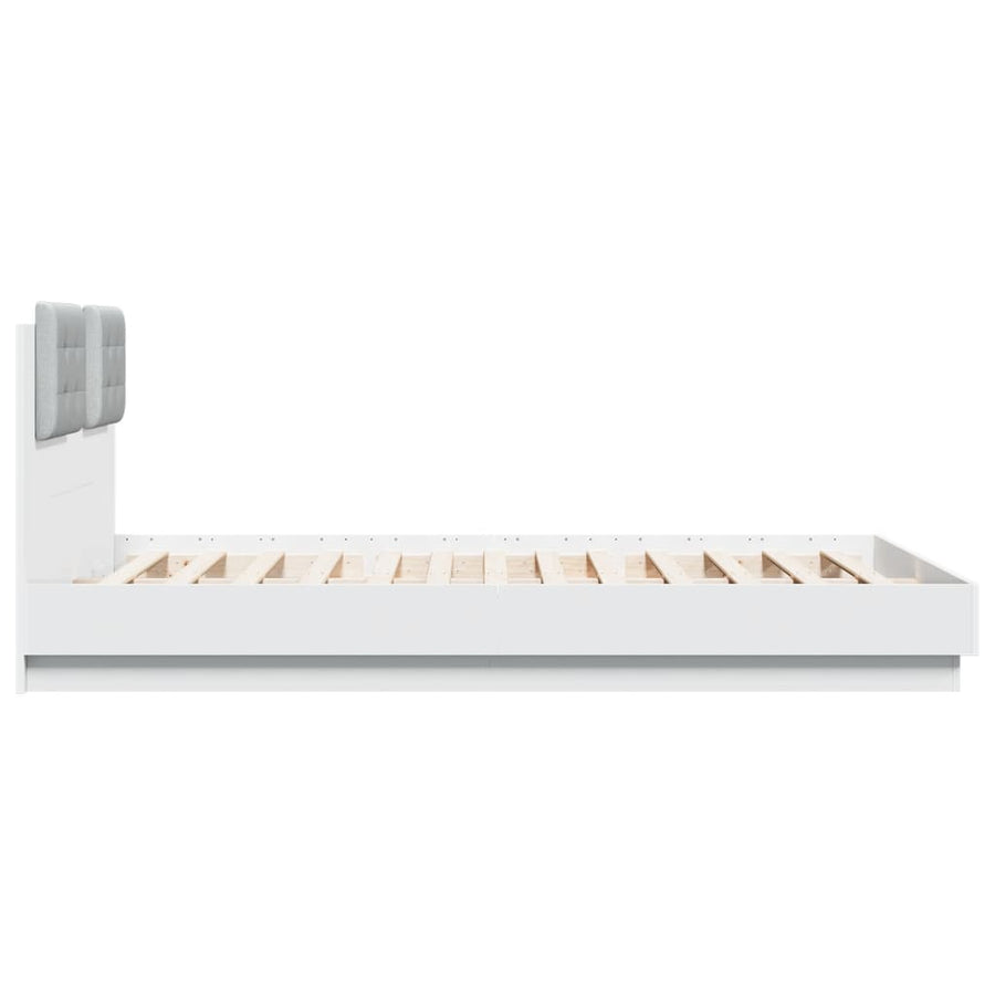 Bedframe met hoofdbord en LED-verlichting wit 140x200 cm