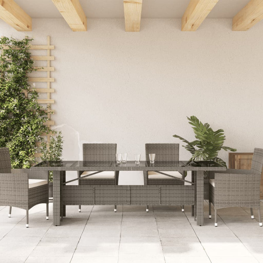 Tuintafel met glazen blad 240x90x75 cm poly rattan grijs