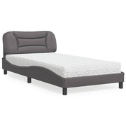 Bed met matras 100x200 cm grijs kunstleer