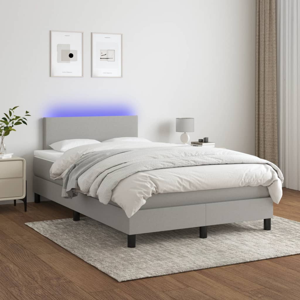 Boxspring met matras en LED stof lichtgrijs 120x190 cm