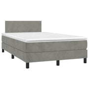 Boxspring met matras en LED 120x190 cm lichtgrijs fluweel