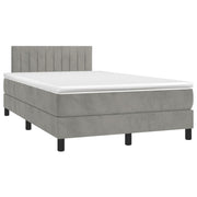 Box spring with mattress and LED velvet light gray 120x190 cm