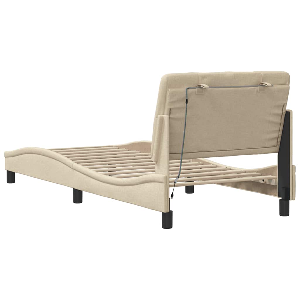 Bedframe met LED zonder matras 90x190 cm stof crèmekleurig