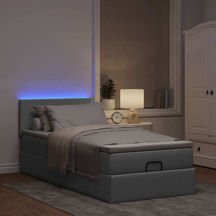 Ottoman bed met matras en LED's 80x200cm stof lichtgrijs
