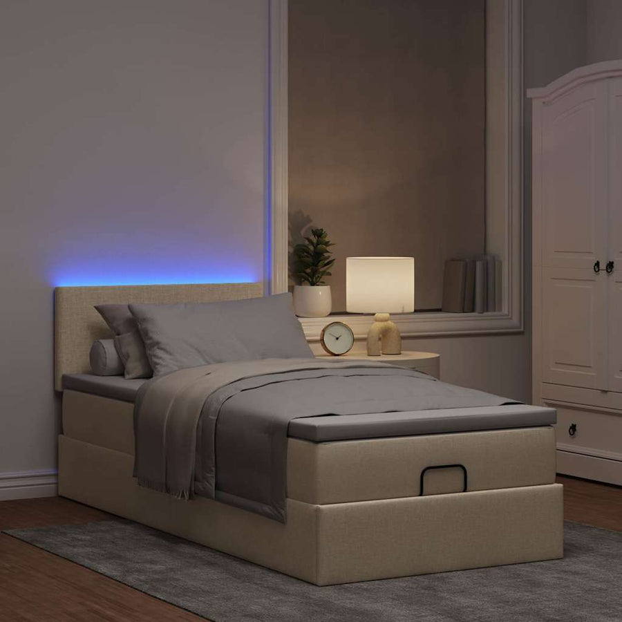 Ottoman bed met matras en LED's 80x200cm stof crèmekleurig