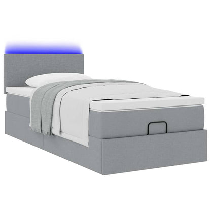 Ottoman bed met matras en LED's 90x200 cm stof lichtgrijs