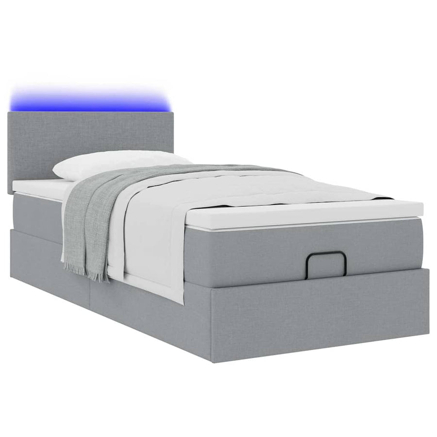 Ottoman bed met matras en LED's 90x200 cm stof lichtgrijs