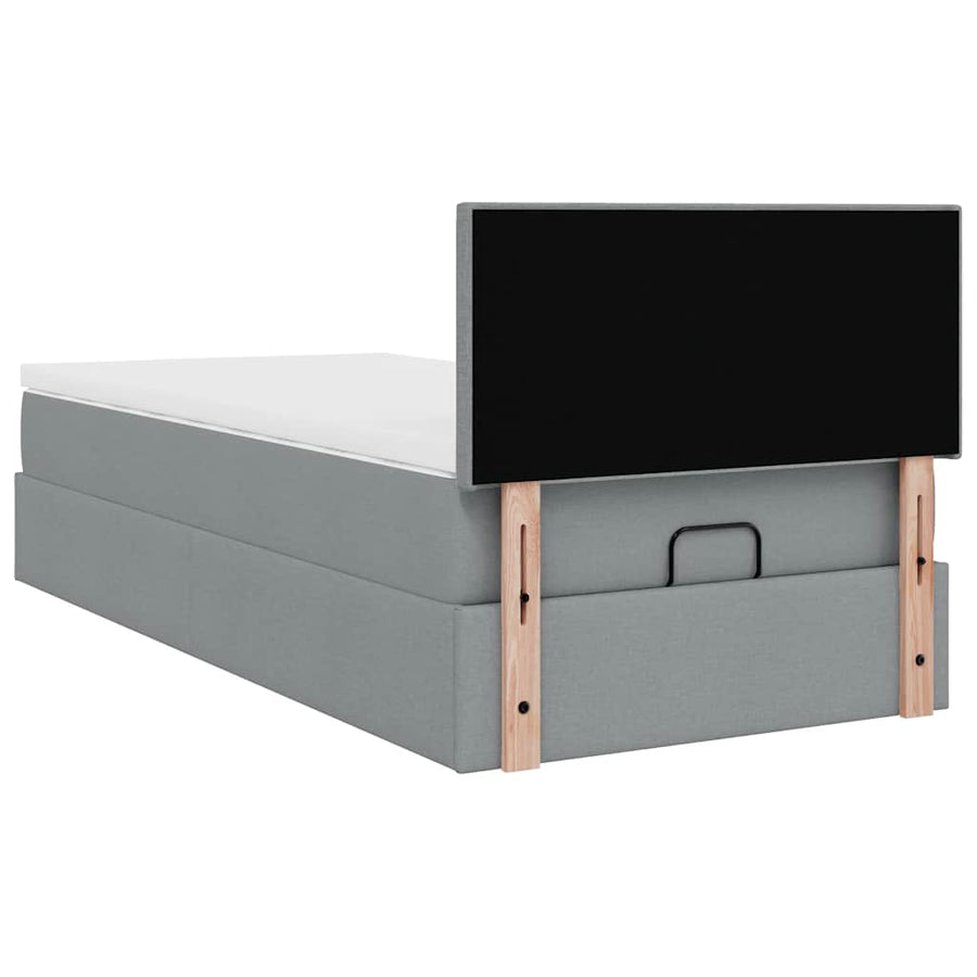 Ottoman bed met matras en LED's 90x200 cm stof lichtgrijs