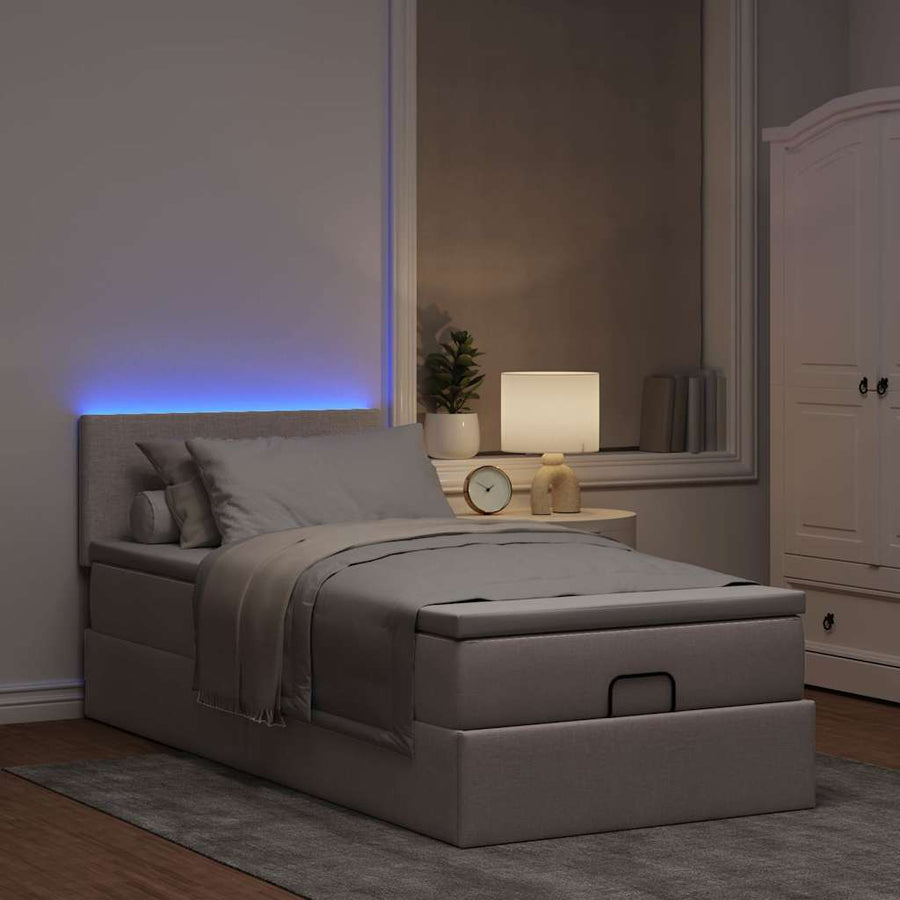 Ottoman bed met matras en LED's 90x200 cm stof taupe