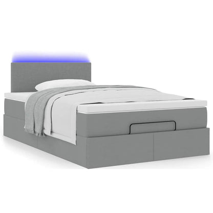 Ottoman bed met matras en LED's 120x200 cm stof lichtgrijs