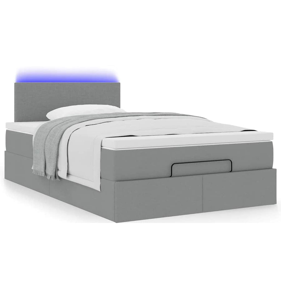Ottoman bed met matras en LED's 120x200 cm stof lichtgrijs