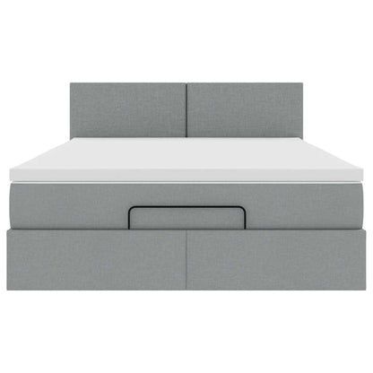 Ottoman bed met matras en LED's 140x200cm stof lichtgrijs